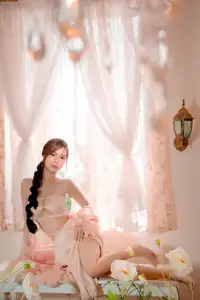 Ethereal Beauty: A Young Woman's Delicate Charm in a Flowing Pink Dress - image 3