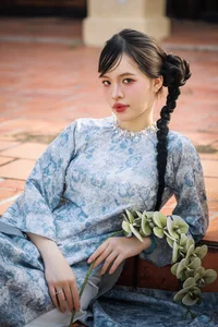 Timeless Grace in Blue Floral Ao Dai and Ancient Architecture - image 5