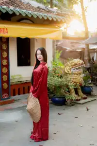 Elegant Vietnamese Beauty in Red Ao Dai: A Glimpse into Traditional Grace - image 10