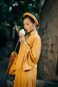 Discover the Graceful Beauty of a Vietnamese Woman in Radiant Yellow Ao Dai with Pure Lotus 1000025235 - image 6