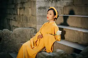 Discover the Graceful Beauty of a Vietnamese Woman in Radiant Yellow Ao Dai with Pure Lotus 1000025235 - image 5