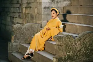 Discover the Graceful Beauty of a Vietnamese Woman in Radiant Yellow Ao Dai with Pure Lotus 1000025235 - image 4