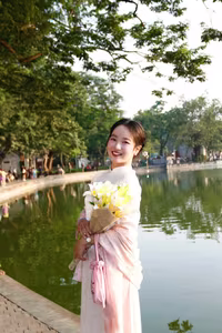 VGU No.148: Radiant Smile in Traditional Ao Dai: Elegant Vietnamese Beauty by the Lake. - image 2