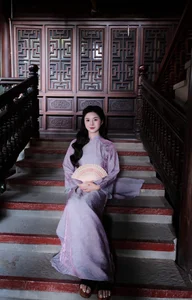 Ethereal Grace in Lavender Ao Dai Amidst Ancient Architecture - image 4
