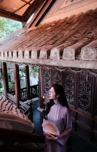 Ethereal Grace in Lavender Ao Dai Amidst Ancient Architecture - image 8