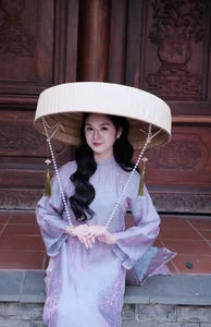 Ethereal Grace in Lavender Ao Dai Amidst Ancient Architecture - image 7