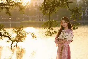 Gentle Vietnamese Beauty: Pink Ao Dai by the Lake, with Pure Lilies - image 9