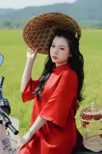 Discover the Serene Beauty: Vietnamese Girl in Red Ao Dai Amidst Green Rice Fields - image 16