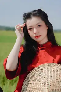 Discover the Serene Beauty: Vietnamese Girl in Red Ao Dai Amidst Green Rice Fields - image 9