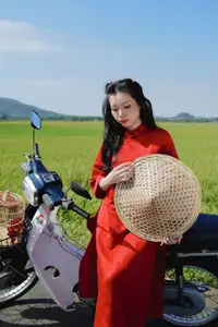 Discover the Serene Beauty: Vietnamese Girl in Red Ao Dai Amidst Green Rice Fields - image 4