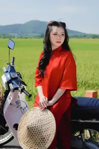 Discover the Serene Beauty: Vietnamese Girl in Red Ao Dai Amidst Green Rice Fields - image 14