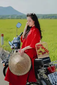 Discover the Serene Beauty: Vietnamese Girl in Red Ao Dai Amidst Green Rice Fields - image 10