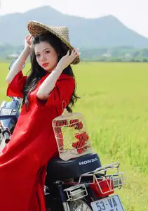 Discover the Serene Beauty: Vietnamese Girl in Red Ao Dai Amidst Green Rice Fields - image 7