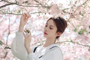Spring Muse: Pure Elegance in JK Uniform Amidst Blossoms - image 2