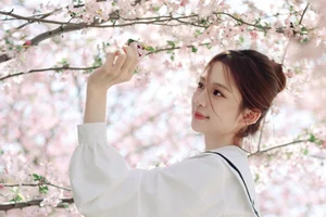 Spring Muse: Pure Elegance in JK Uniform Amidst Blossoms - image 24