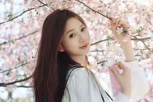 Spring Muse: Pure Elegance in JK Uniform Amidst Blossoms - image 12