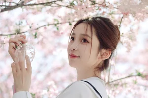 Spring Muse: Pure Elegance in JK Uniform Amidst Blossoms - image 9