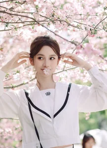 Spring Muse: Pure Elegance in JK Uniform Amidst Blossoms - image 1