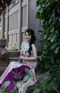 Enchanting Vietnamese Beauty: A Graceful Portrait in Modern Traditional Dress and Fan - image 2