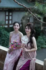 Enchanting Vietnamese Beauty: A Graceful Portrait in Modern Traditional Dress and Fan - image 3