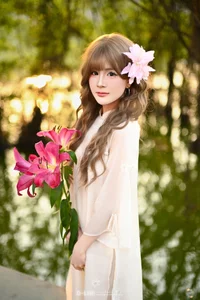 Poetic Muse in White Dress with Pink Lilies - image 3