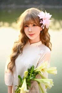 Poetic Muse in White Dress with Pink Lilies - image 2