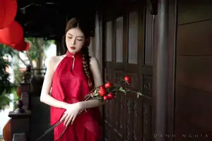 Captivating Asian Girl in Red: Serene Lotus & Rustic Wooden Stairs Scene - image 2