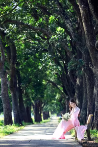 VGU No.150: Graceful Vietnamese Beauty in Pink Ao Dai on a Serene Path - image 5