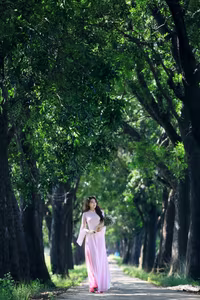 VGU No.150: Graceful Vietnamese Beauty in Pink Ao Dai on a Serene Path - image 3