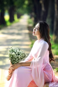 VGU No.150: Graceful Vietnamese Beauty in Pink Ao Dai on a Serene Path - image 0