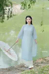 Elegant Vietnamese Maiden in Áo Dài Amidst Serene Nature's Embrace - image 8