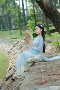 Elegant Vietnamese Maiden in Áo Dài Amidst Serene Nature's Embrace - image 9