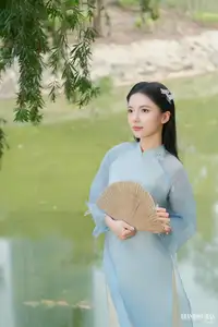Elegant Vietnamese Maiden in Áo Dài Amidst Serene Nature's Embrace - image 6