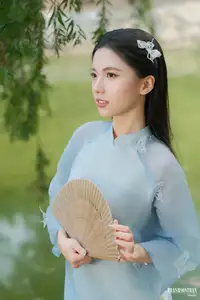Elegant Vietnamese Maiden in Áo Dài Amidst Serene Nature's Embrace - image 10