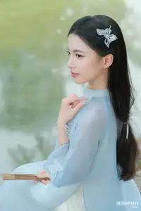 Elegant Vietnamese Maiden in Áo Dài Amidst Serene Nature's Embrace - image 5