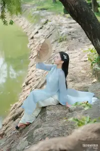 Elegant Vietnamese Maiden in Áo Dài Amidst Serene Nature's Embrace - image 3