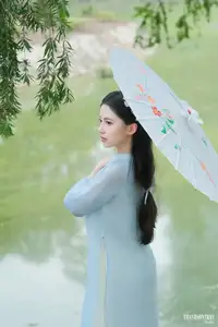 Elegant Vietnamese Maiden in Áo Dài Amidst Serene Nature's Embrace - image 15