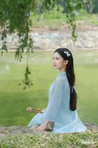 Elegant Vietnamese Maiden in Áo Dài Amidst Serene Nature's Embrace - image 1