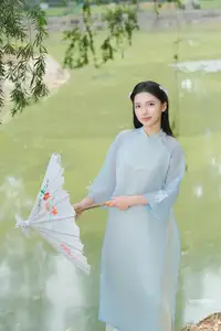 Elegant Vietnamese Maiden in Áo Dài Amidst Serene Nature's Embrace - image 12