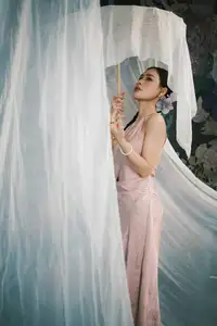 Discover Vietnamese Grace: An Elegant Girl in Ao Yem with a Red Fan. - image 4
