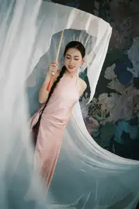 Discover Vietnamese Grace: An Elegant Girl in Ao Yem with a Red Fan. - image 5