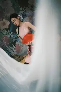 Discover Vietnamese Grace: An Elegant Girl in Ao Yem with a Red Fan. - image 7