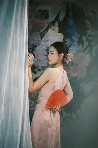 Discover Vietnamese Grace: An Elegant Girl in Ao Yem with a Red Fan. - image 0