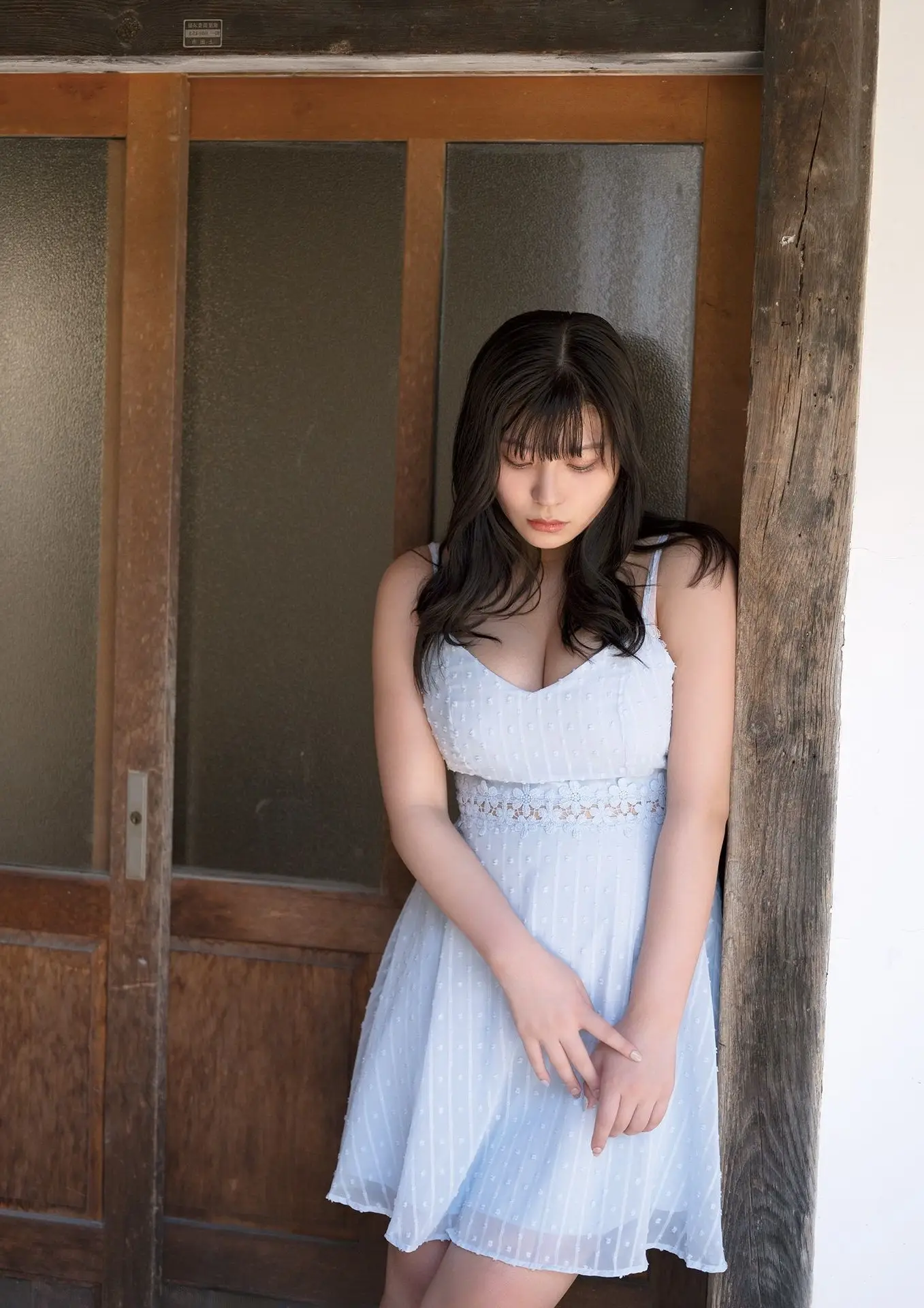 Radiant Beauty on Wooden Steps: A Timeless Moment of Youth