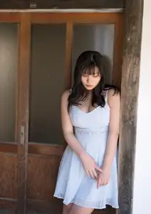 Radiant Beauty on Wooden Steps: A Timeless Moment of Youth - image 0