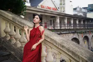 Gentle Vietnamese Girl in Red by Old Railway Bridge: Elegant Asian Beauty - image 3