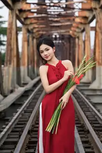 Gentle Vietnamese Girl in Red by Old Railway Bridge: Elegant Asian Beauty - image 7