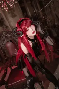 Coser Qie Qie Celia Transforms into Hindenburg: The Alluring Mystique of the Red-Haired Demoness in Unique Cosplay Photoshoot. - image 2