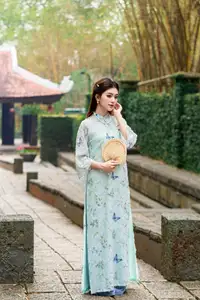 Graceful Ao Dai Girl Amidst Bamboo: Timeless Beauty and Serenity - image 2