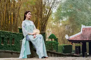 Graceful Ao Dai Girl Amidst Bamboo: Timeless Beauty and Serenity - image 3
